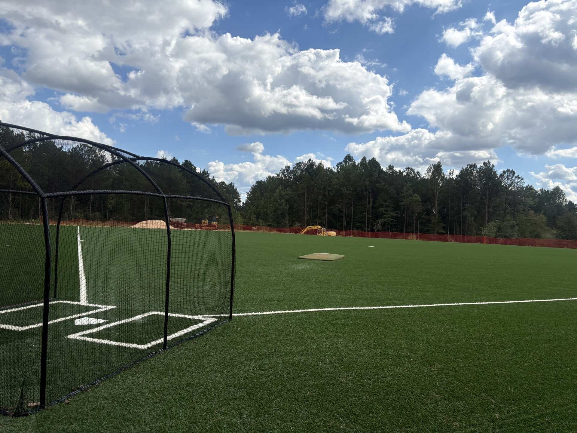Batting cage on a turf baseball field