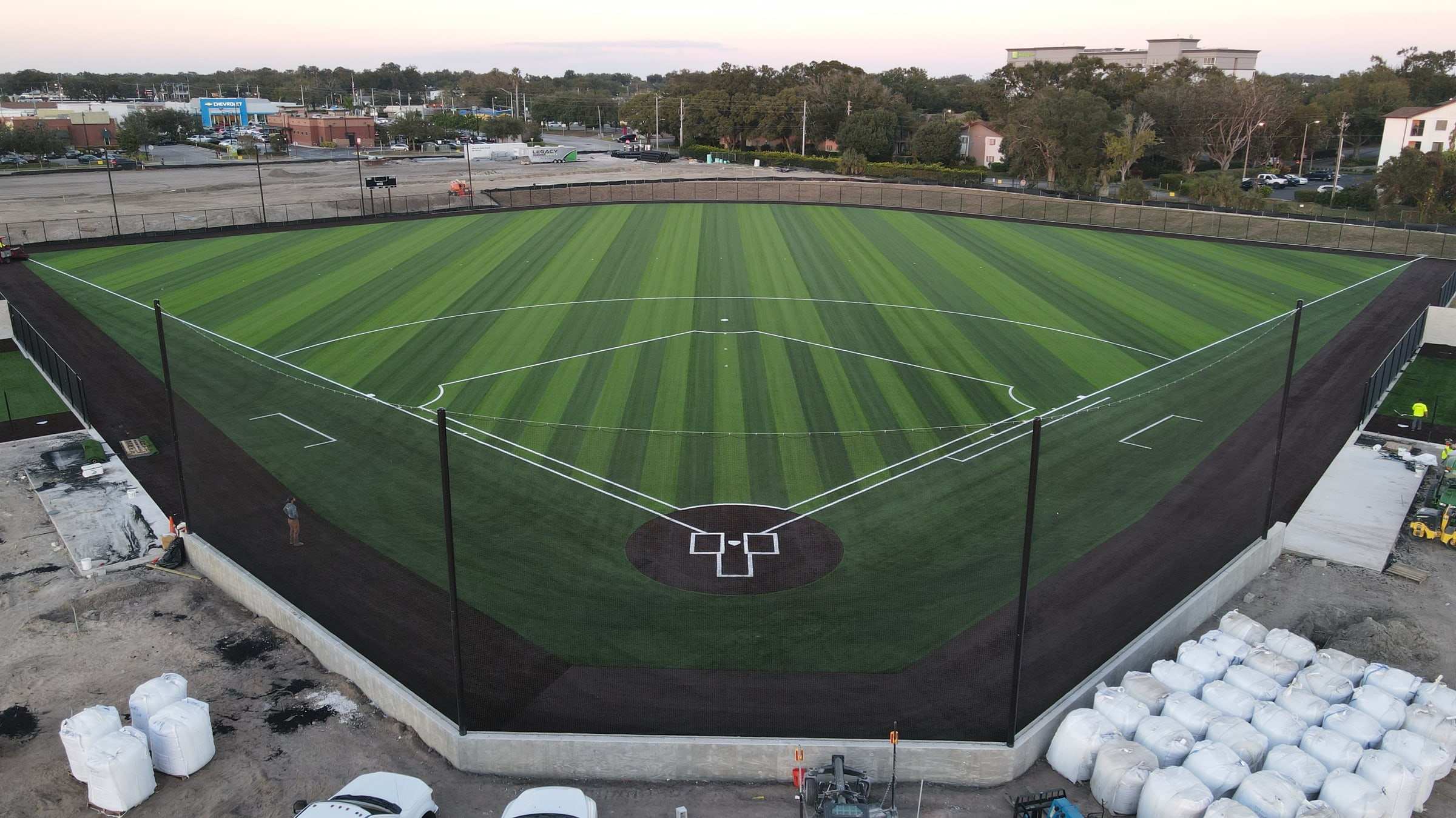 Striped turf baseball field from behind home plate