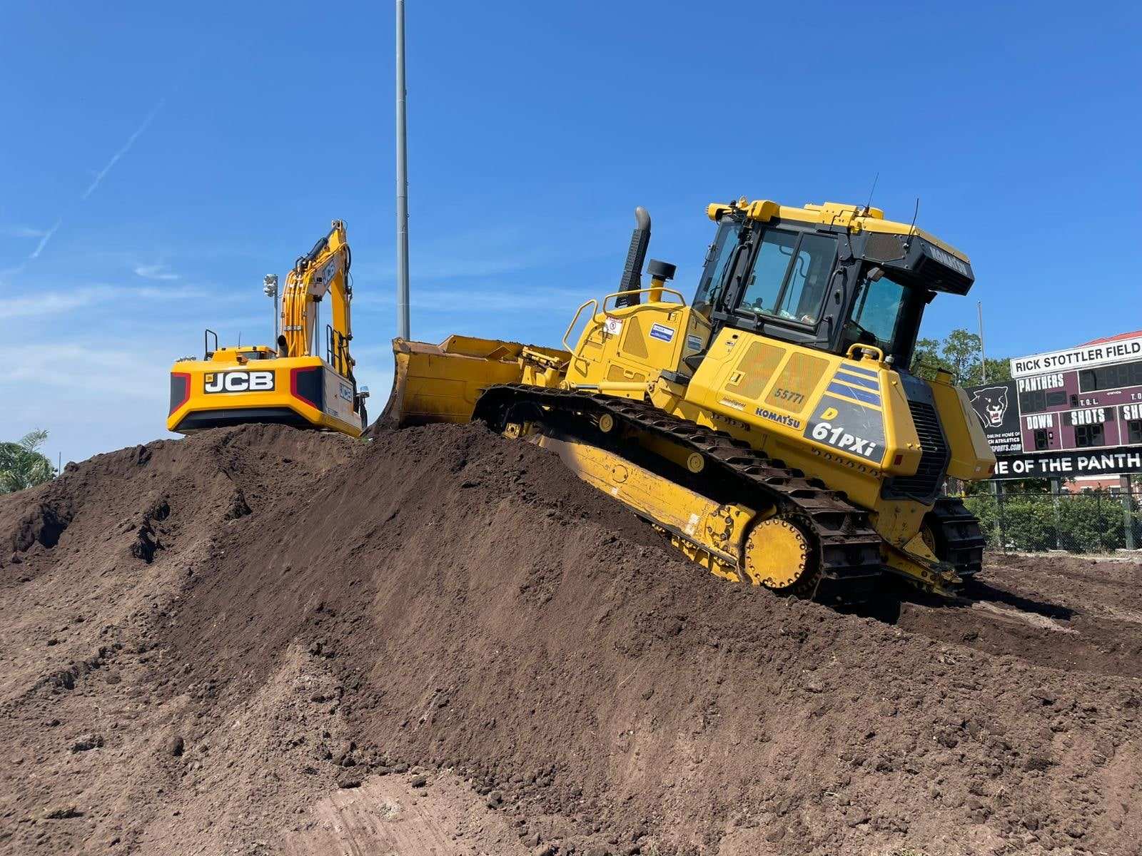 Bulldozer grading a sports field site