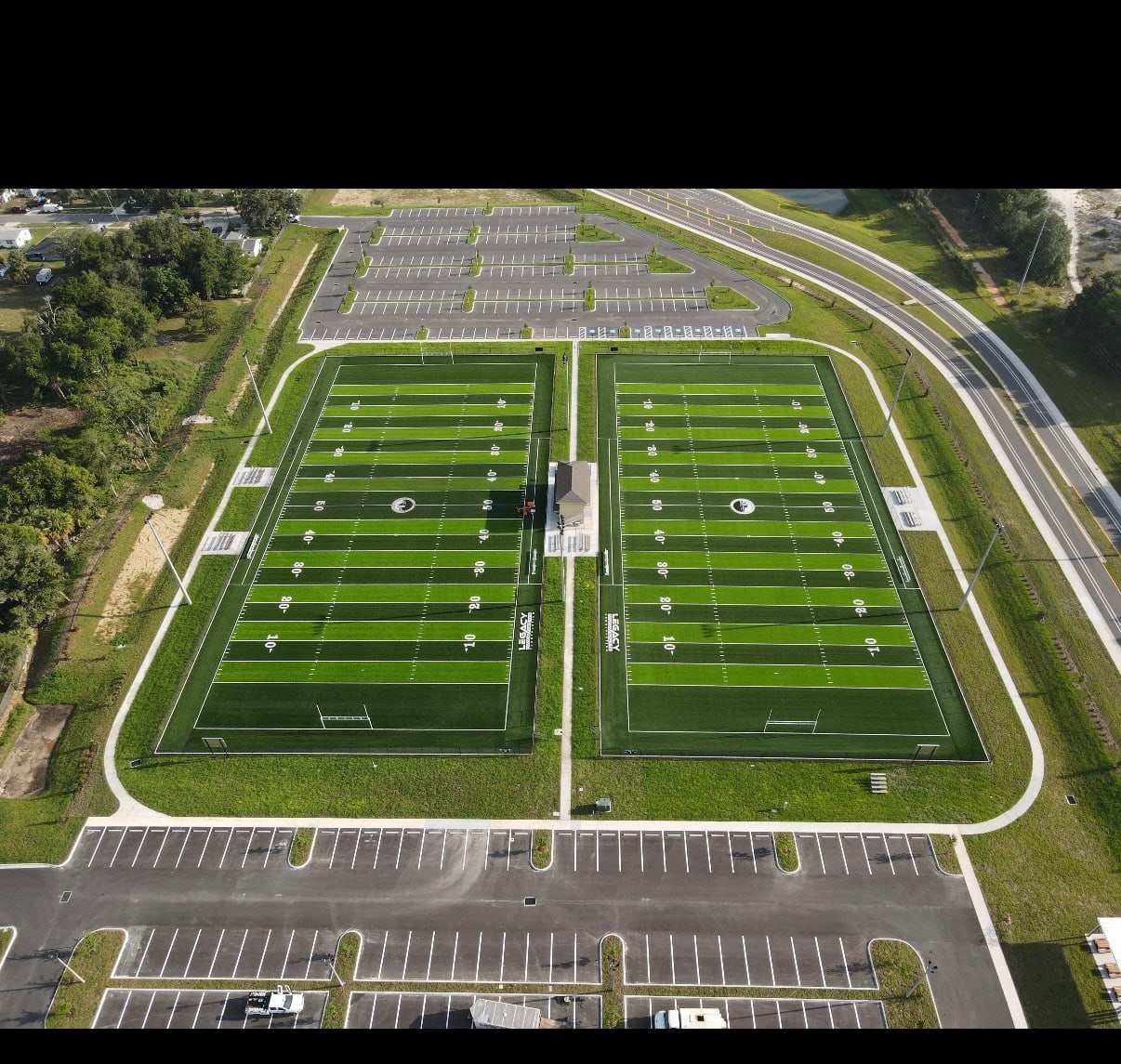 Overhead view of two side-by-side turf football fields