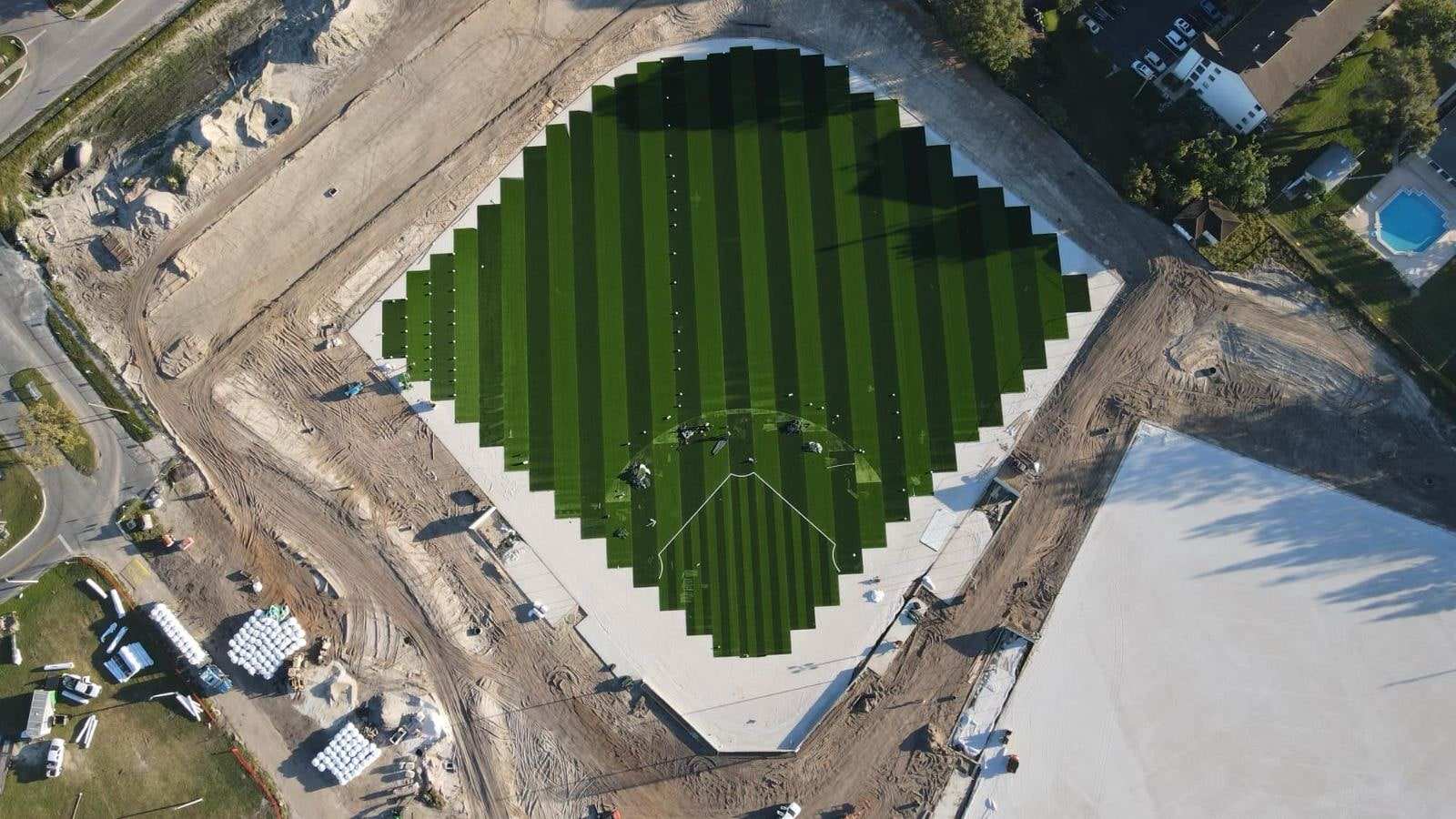 Striped turf rolls laid on a ballfield